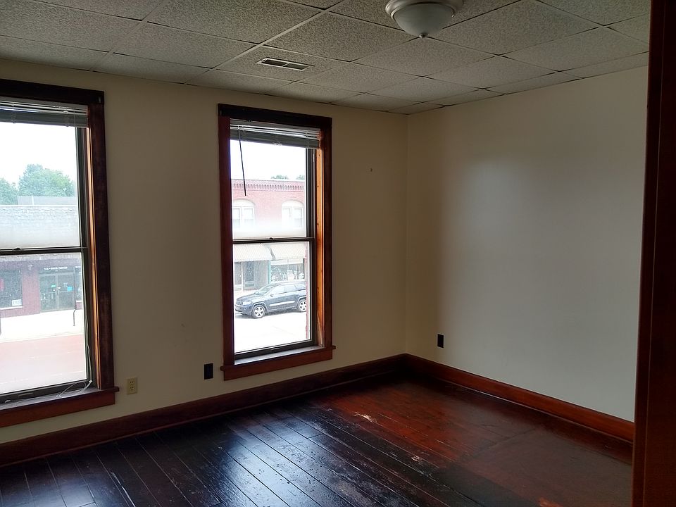 The bedroom, with a view out on Superior Street.