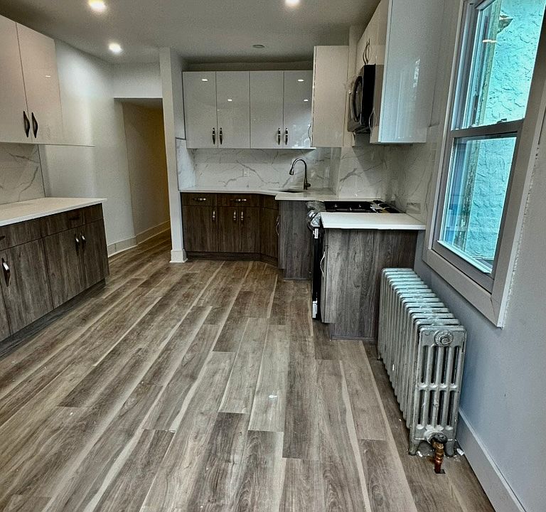 Freshly renovated kitchen, new stainless steel Samsung appliances, side by side refrigerator, new stove, new floors.