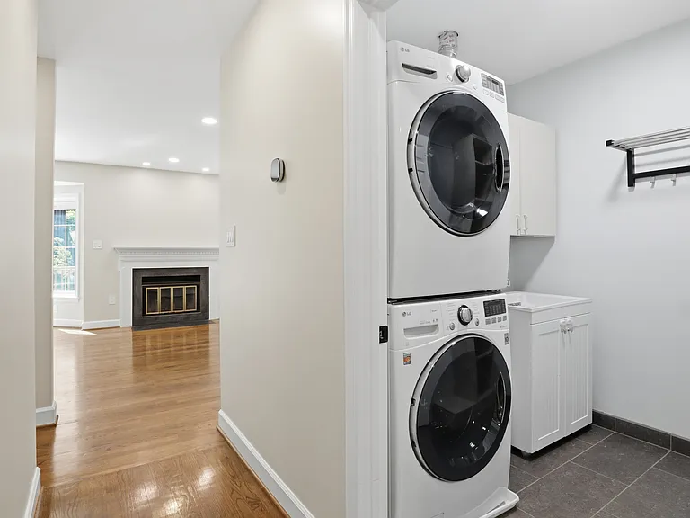 Laundry Room with Large Washer & Dryer, Tub Sink and Hanging Racks