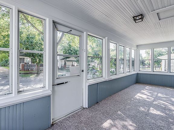 Enclosed front porch.