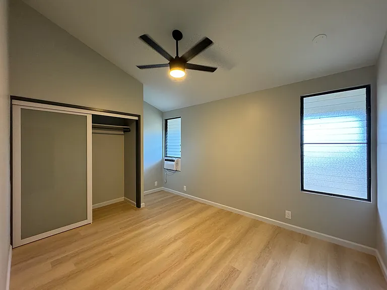 Bedroom #3 upstairs. Window AC, high ceilings and fan/light.