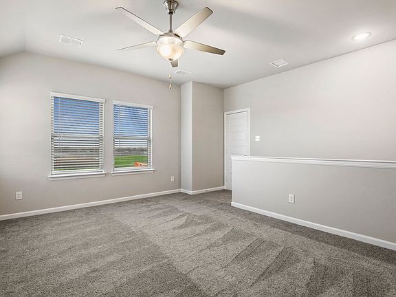Game room in the Stanley home plan by Trophy Signature Homes - REPRESENTATIVE PHOTO