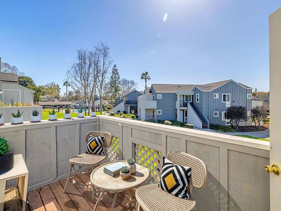 Private balcony with serene views and sunny outdoor seating.