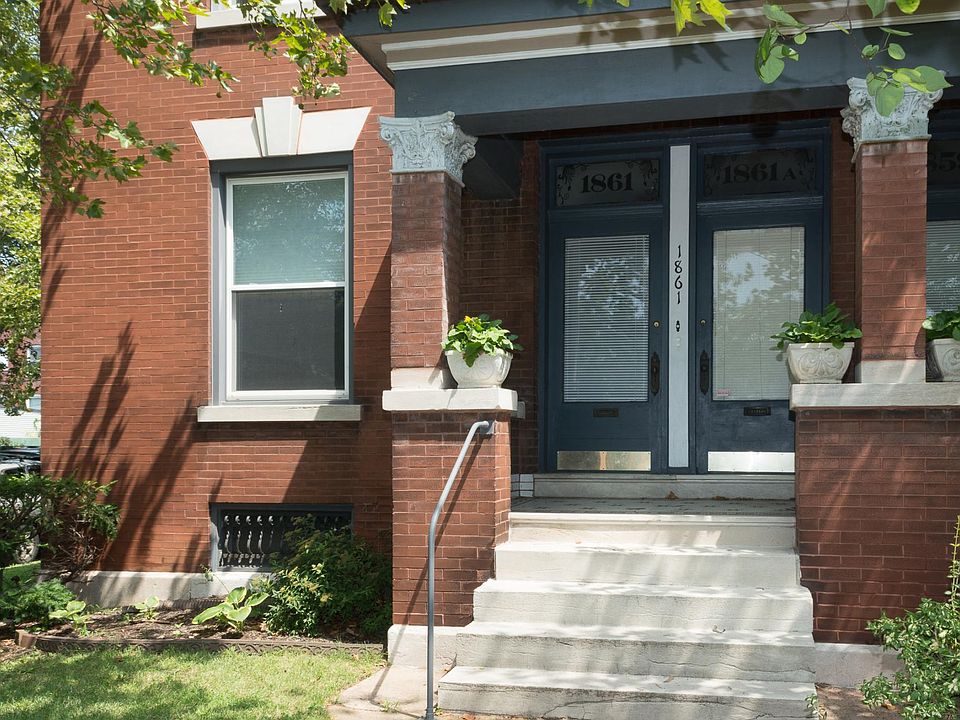Entrance to 1861 Russell Blvd., 1F in McKinley Heights, erected in 1906. Located on the North East corner of Russell and Mississippi, Sycamore and Maple trees on the side, Red Bud in the front.