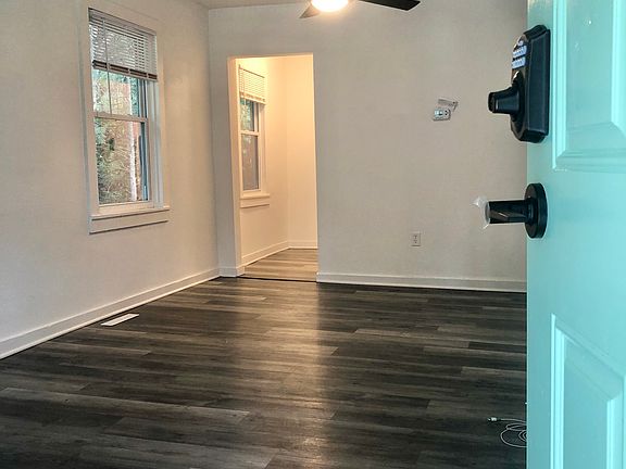 Front Living room, new flooring, new ceiling fan & light.