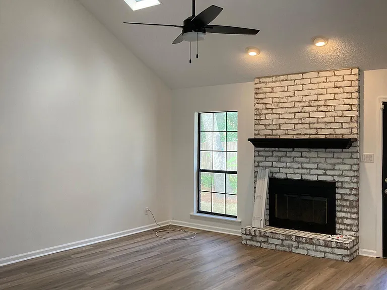 Fireplace mantle now freshly painted in a soft cream. Sky lights are great for extra lighting but sound as if you are in a house with a tin roof when it rains! It's very relaxing-