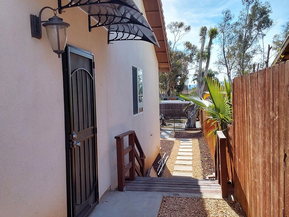 Beautiful private secured entry.
Stairs lead to outdoor back yard deck.