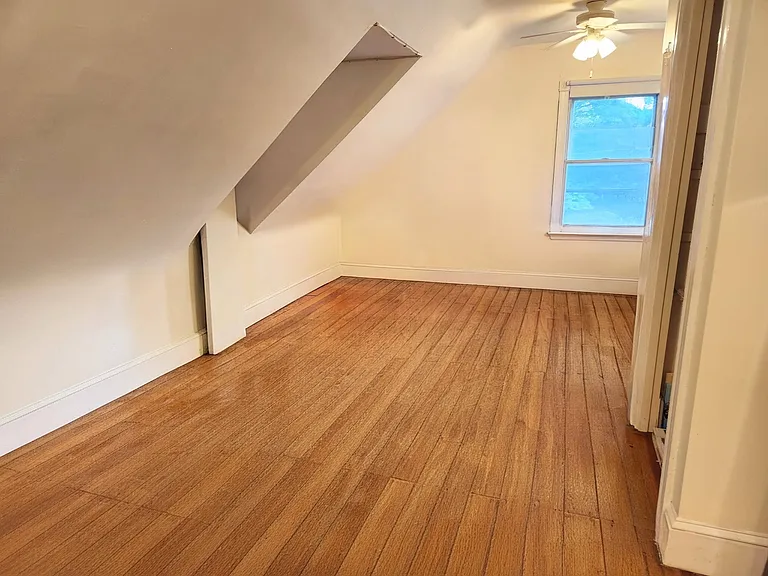 Thrird floor bedroom with sloped ceiling