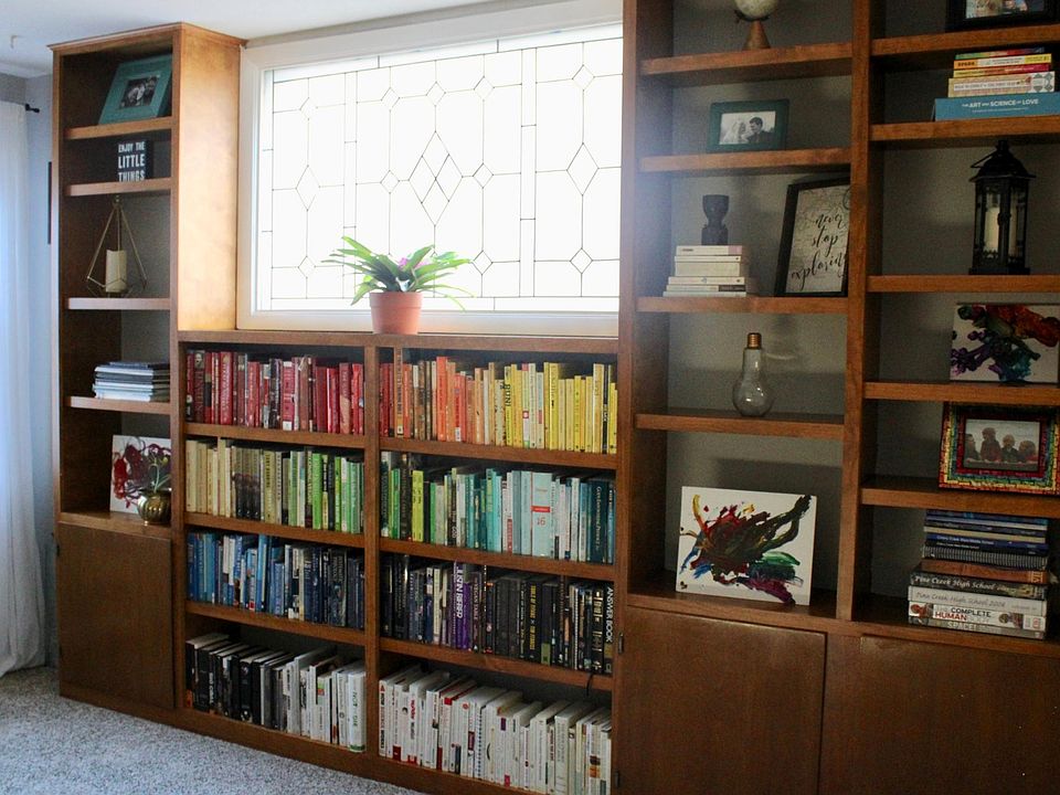 Beautiful built-in bookshelves and stained glass window