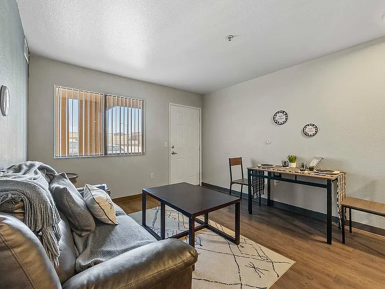 Experience comfort and style in this cozy living space, perfect for relaxation and dining.