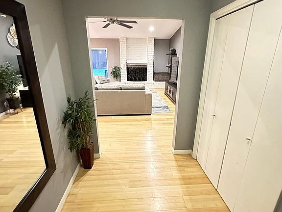 Foyer with coat closet that opens up to living areas.