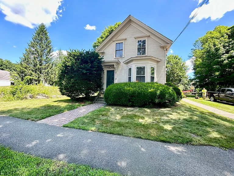 Front of house with Entrance for apartment