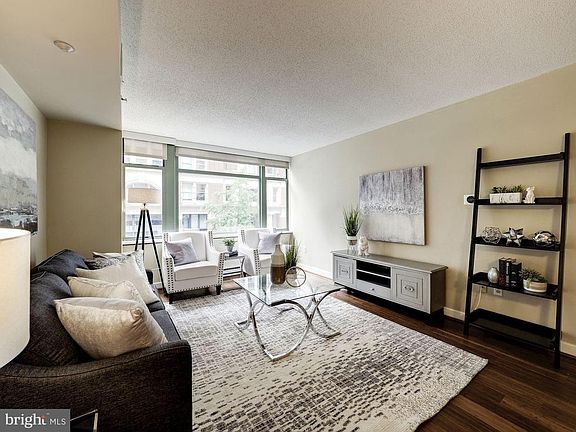 West facing wall of windows in living room