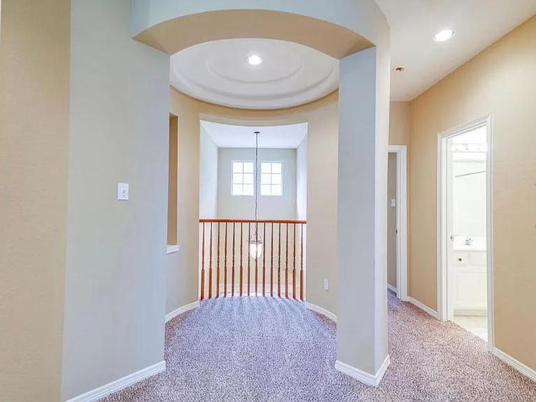 Upstairs is carpet. This is a small area, maybe a desk area