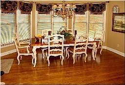 Spacious breakfast area in kitchen with lots of window to allow for natural li