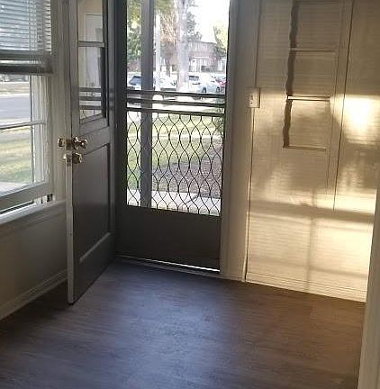 Breakfast nook in kitchen also has side entrance to San Antonio Drive. Small built-i