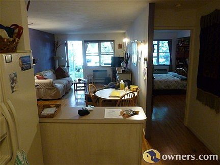 Kitchen looking into the living room/bedroom/outside patio