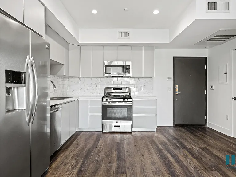 Front Entrance and Kitchen with Energy-Efficient Appliances