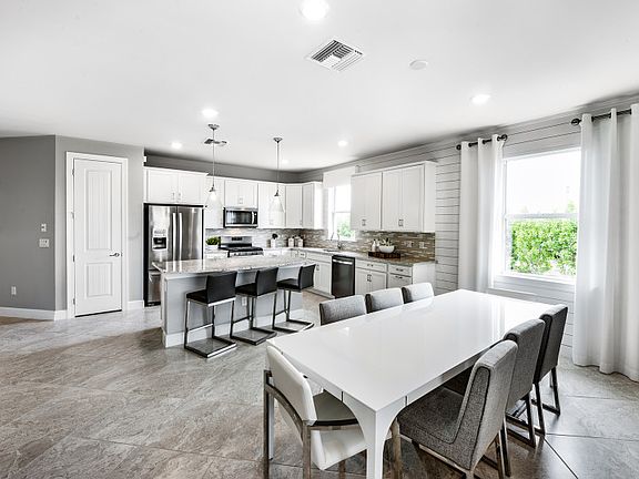 Model Representation Cafe dining located off of the kitchen