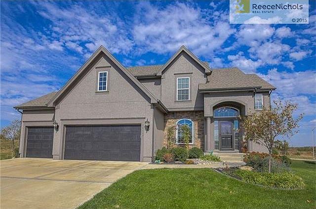 Nothing but green space surrounding this home.
