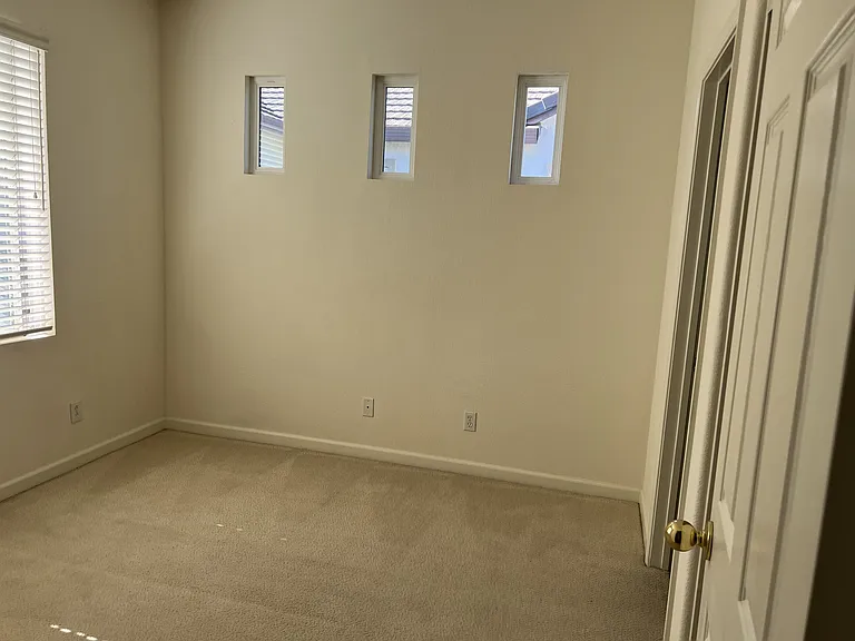 Bedroom 1 connected to Jack & Jill bathroom. Large sliding door closet.