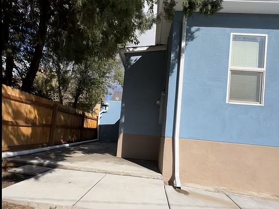 South West corner view straight north into back yard towards non-attached garage (end of white drain pipe)