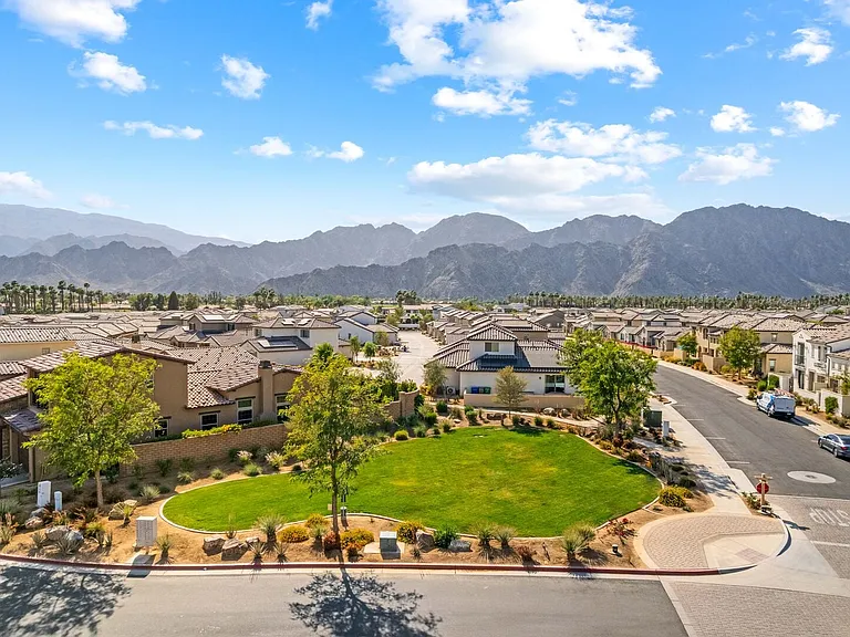 A serene community offering an open dog park, lush green spaces, and breathtaking mountain views. Perfect for relaxing strolls and outdoor living.