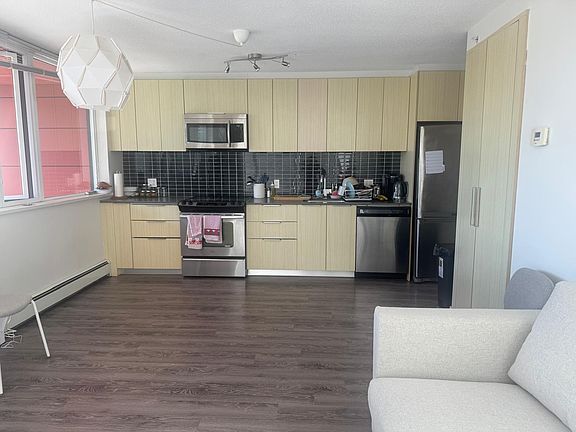 dining table has since been added

laundry and dryer in closet by couch