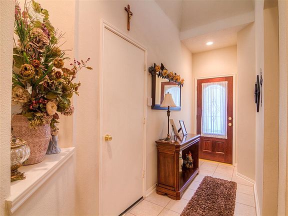 Foyer: Mahogany front door, tile flooring and high ceilings with skylight