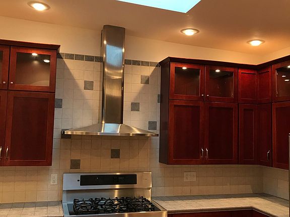 Kitchen skylight and butcher block island.