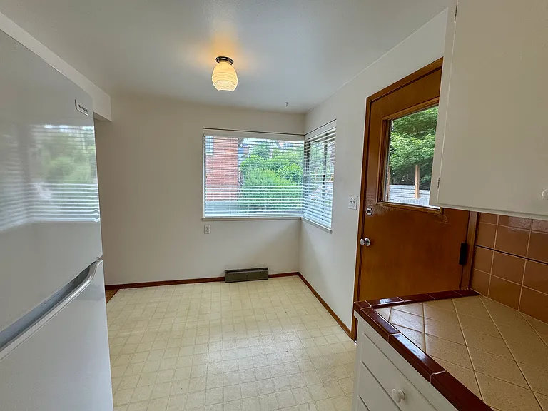 Eat in kitchen area... door to private fenced back yard.