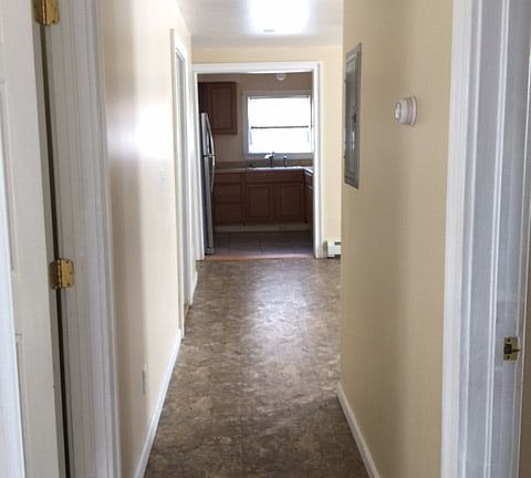 Beautiful Main hallway with an elegant marble style floor. I