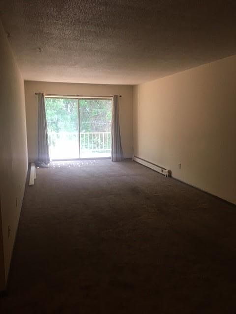 Large Living room with deck over looking back garden area