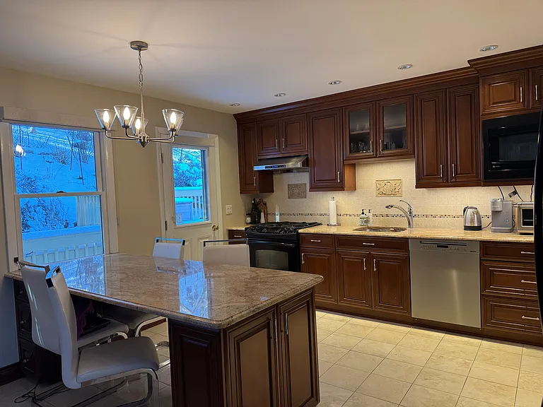 This is the kitchen. It seats 4 people at the counter. There is also a adjacent dining room which seats 6.