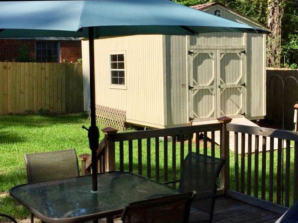 Fenced Backyard with deck and shed