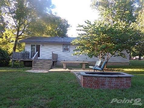 Such a peaceful setting with pleasant sitting area on the deck or patio!
