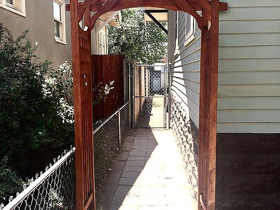 Walkway to gated backyard