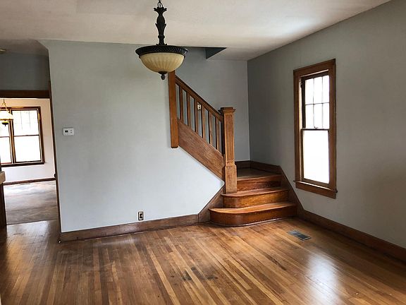 Standing in dining room seeing the kitchen door and stairway