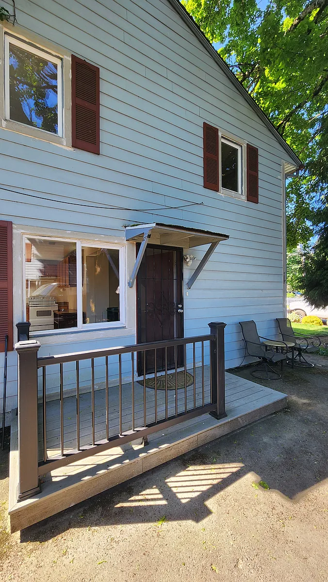 Side door with fenced deck on side of home. - 1905 Fairmount Ave