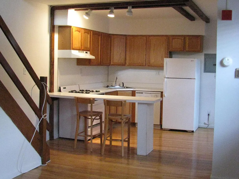 Kitchen w/ breakfast bar (looking from living room)