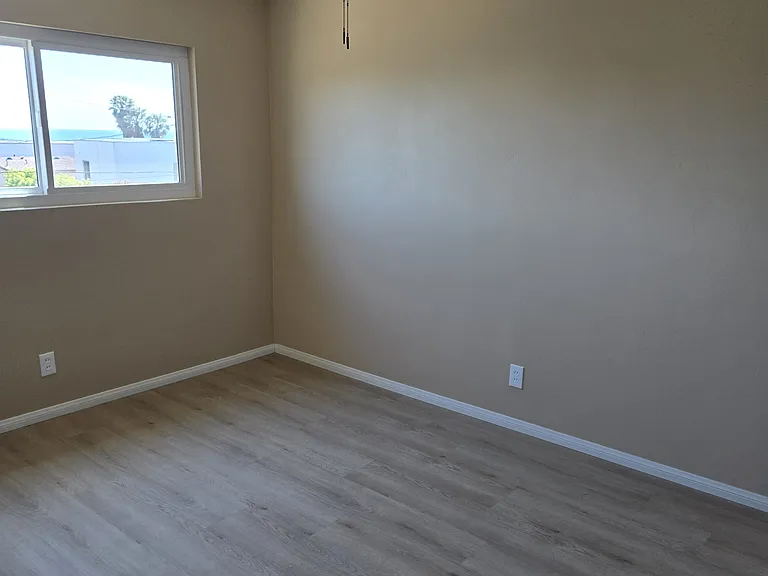 South bedroom with fan.