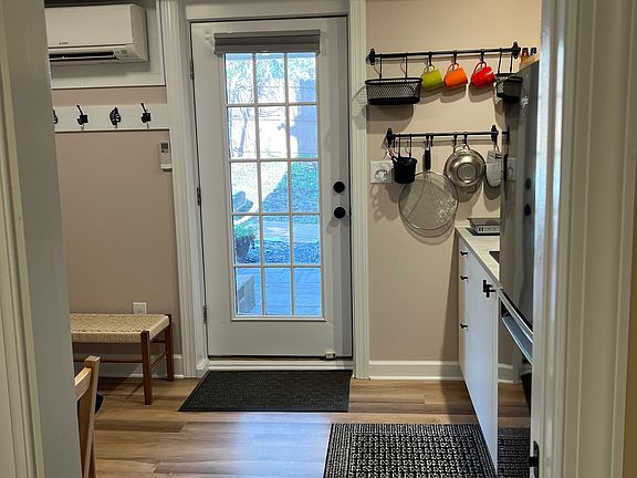 From the bedroom to the kitchen. There is a pocket door that separates the bedroom and the kitchen.