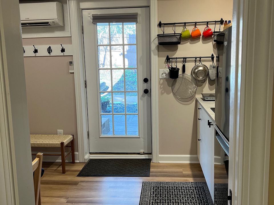 From the bedroom to the kitchen. There is a pocket door that separates the bedroom and the kitchen.
