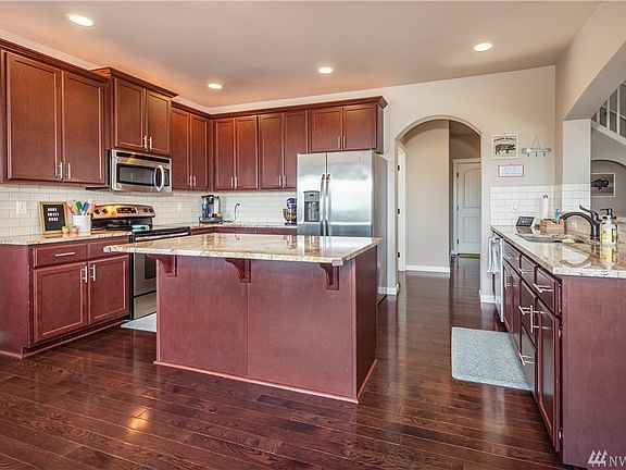Kitchen has gorgeous granite counters & center island