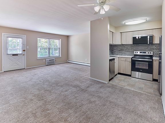Modern open-layout kitchen and living area at 42 West Apartments in Merchantville, NJ
