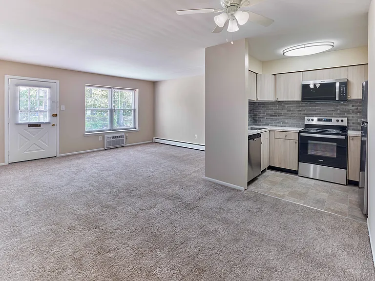 Modern open-layout kitchen and living area at 42 West Apartments in Merchantville, NJ