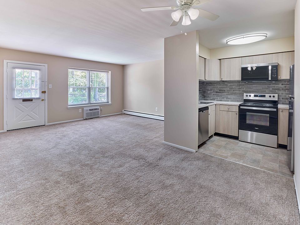 Modern open-layout kitchen and living area at 42 West Apartments in Merchantville, NJ
