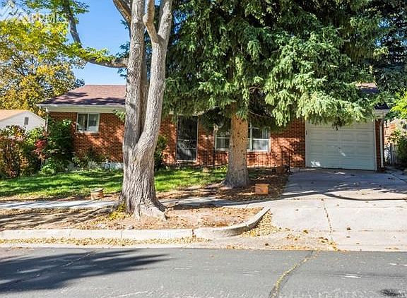 Classic brick is hard to find and this one has an attached garage, too!