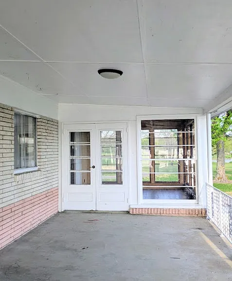 The outside porch view of the sunroom.
