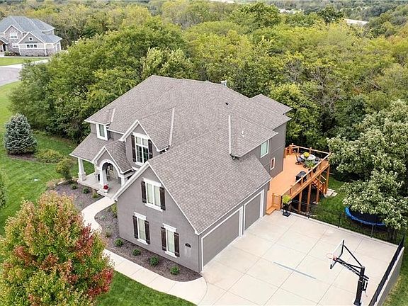 Side entry three car garage and large rear deck.
